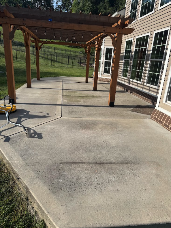 Pergola concrete patio before pressure washing