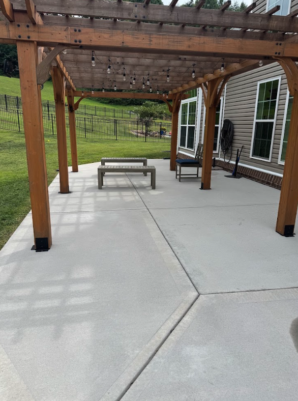 Pergola concrete patio bright and clean after pressure washing